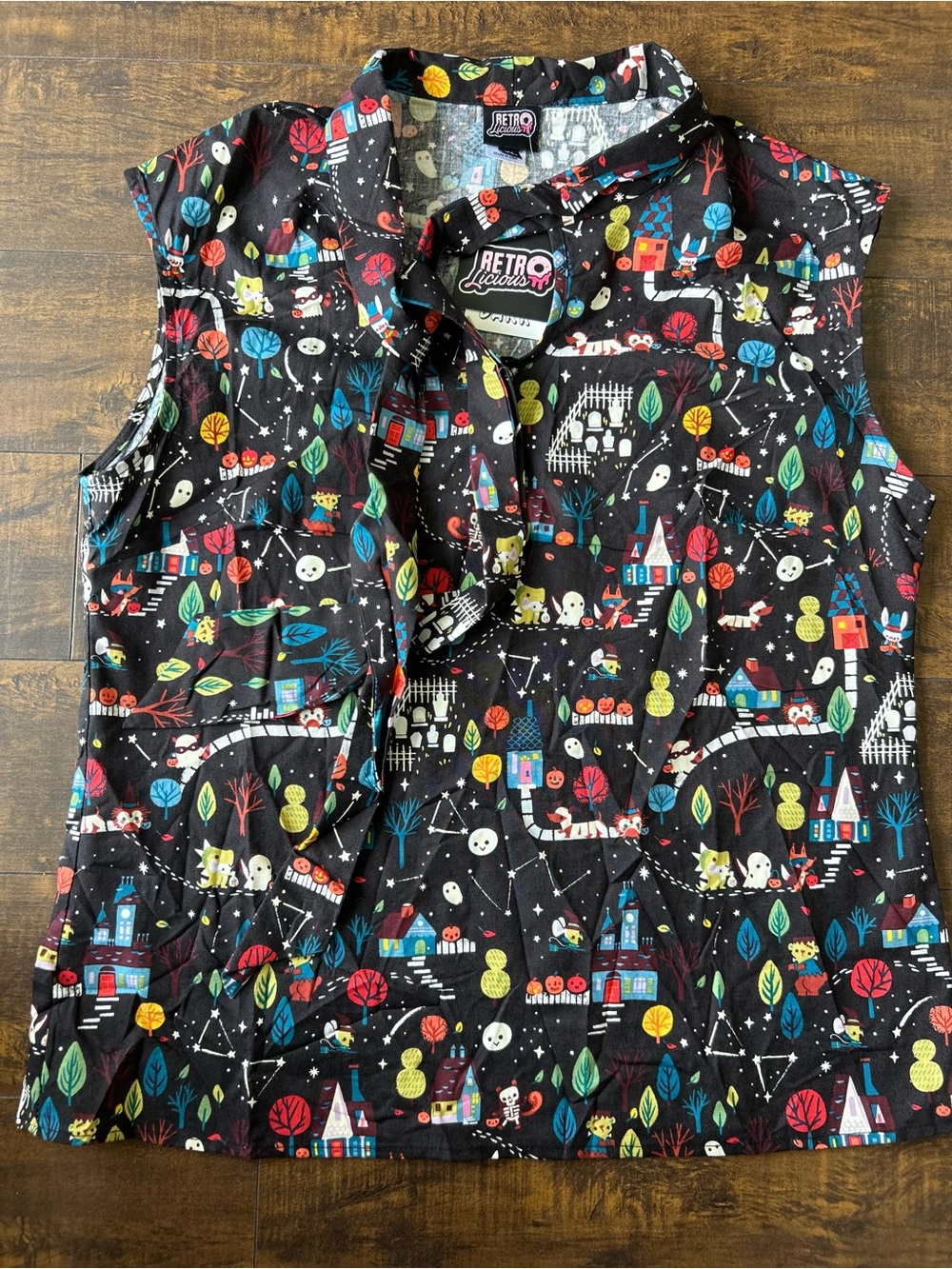 Retrolicious Black Sleeveless Collared Top with Halloween Print